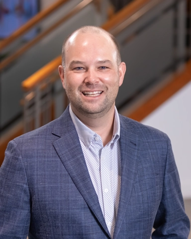 portrait of a smiling person in professional attire